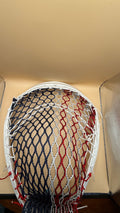 Warrior Nemesis goalie lacrosse head with red white and blue mesh