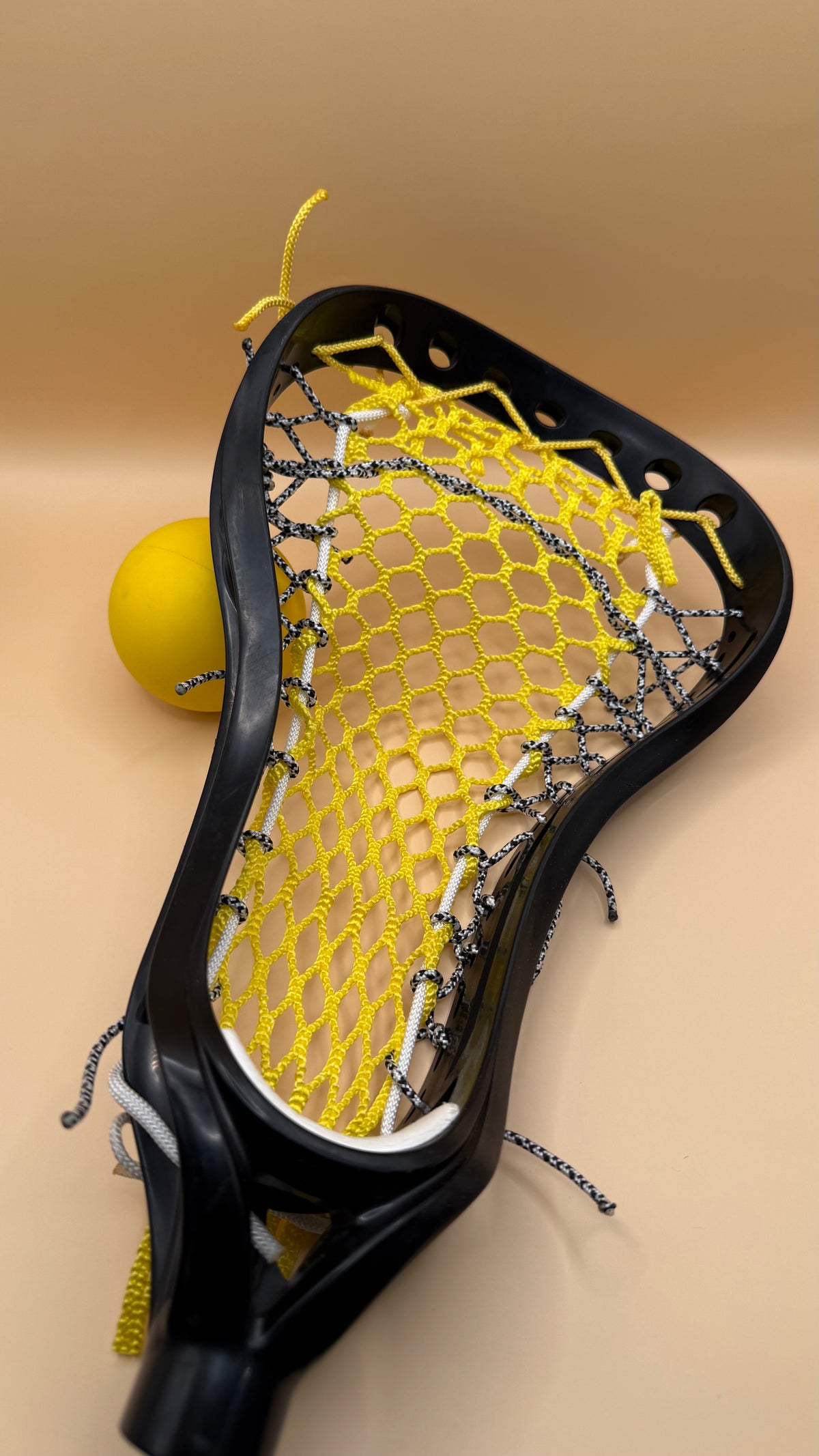 Brine Amonte girls lacrosse head, yellow mesh, black and white strings