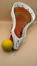 Warrior boys lacrosse head, Halloween edition, orange mesh with lime green and black sidewall strings